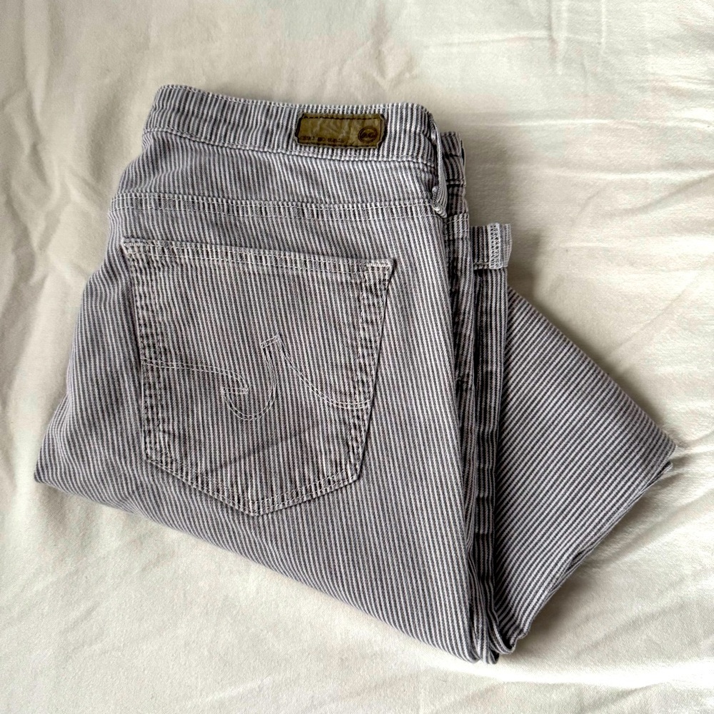 AG black and white striped “the stilt” cigarette roll up jeans.